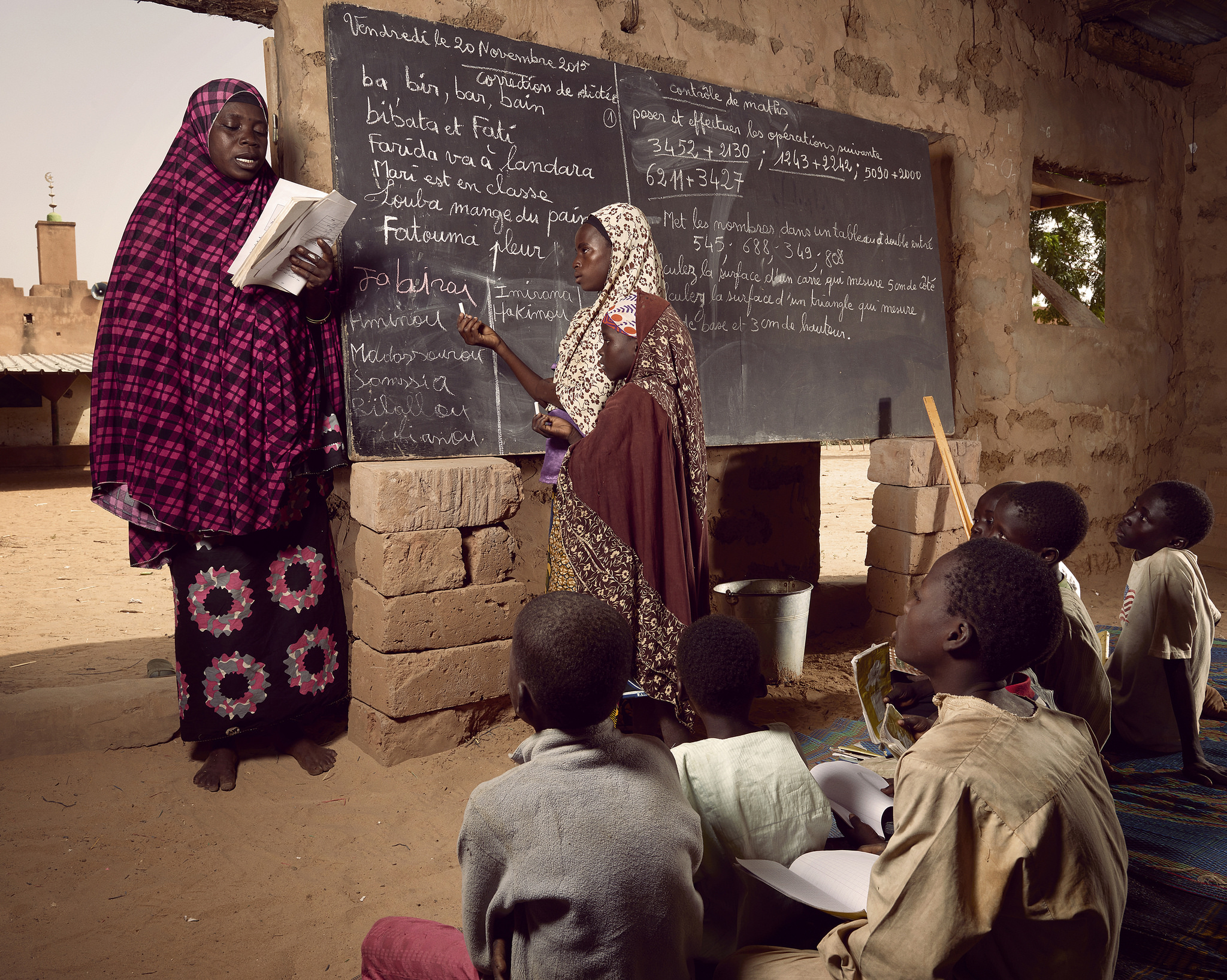 Children in the village of Guéchémé use a omen’s prayer space to pursue their studies while a new school is being built, World Bank Photo Collection, Flickr