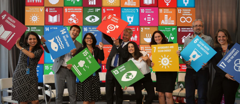 People with SDG signs. Photo credit: UN Climate Change.