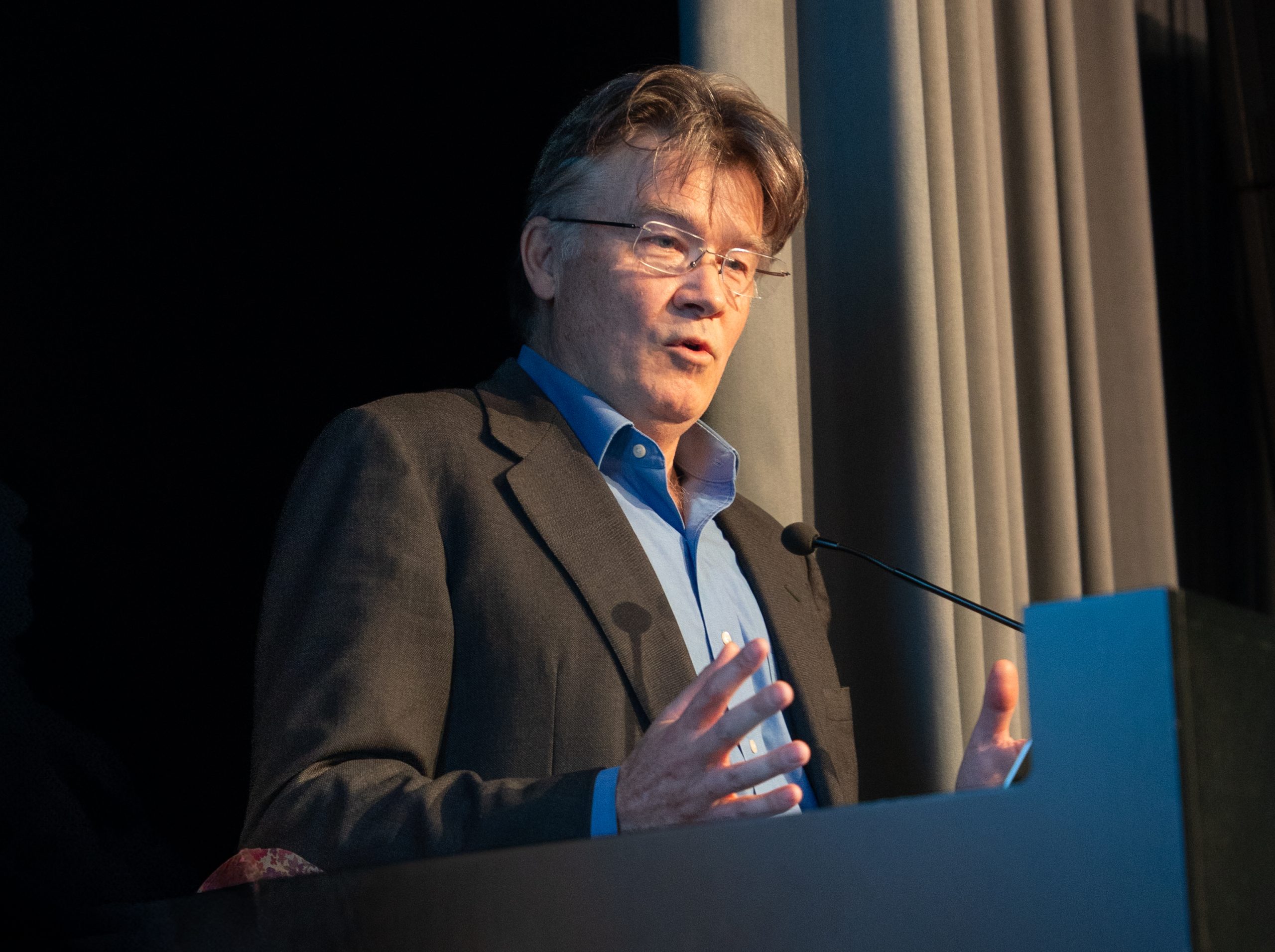 Angus Mackay addressing the audience at the No Borders for Climate Action event. Photo credit: Lorenzo Franchi / UNITAR 